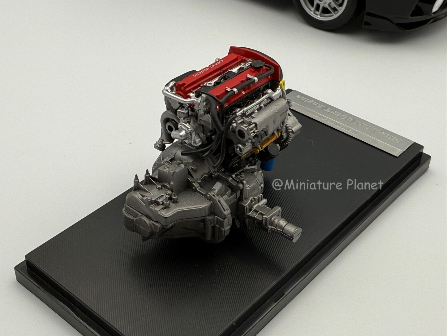 Motorhelix 1:18 Mitsubishi Evolution IV (Black Pearl)