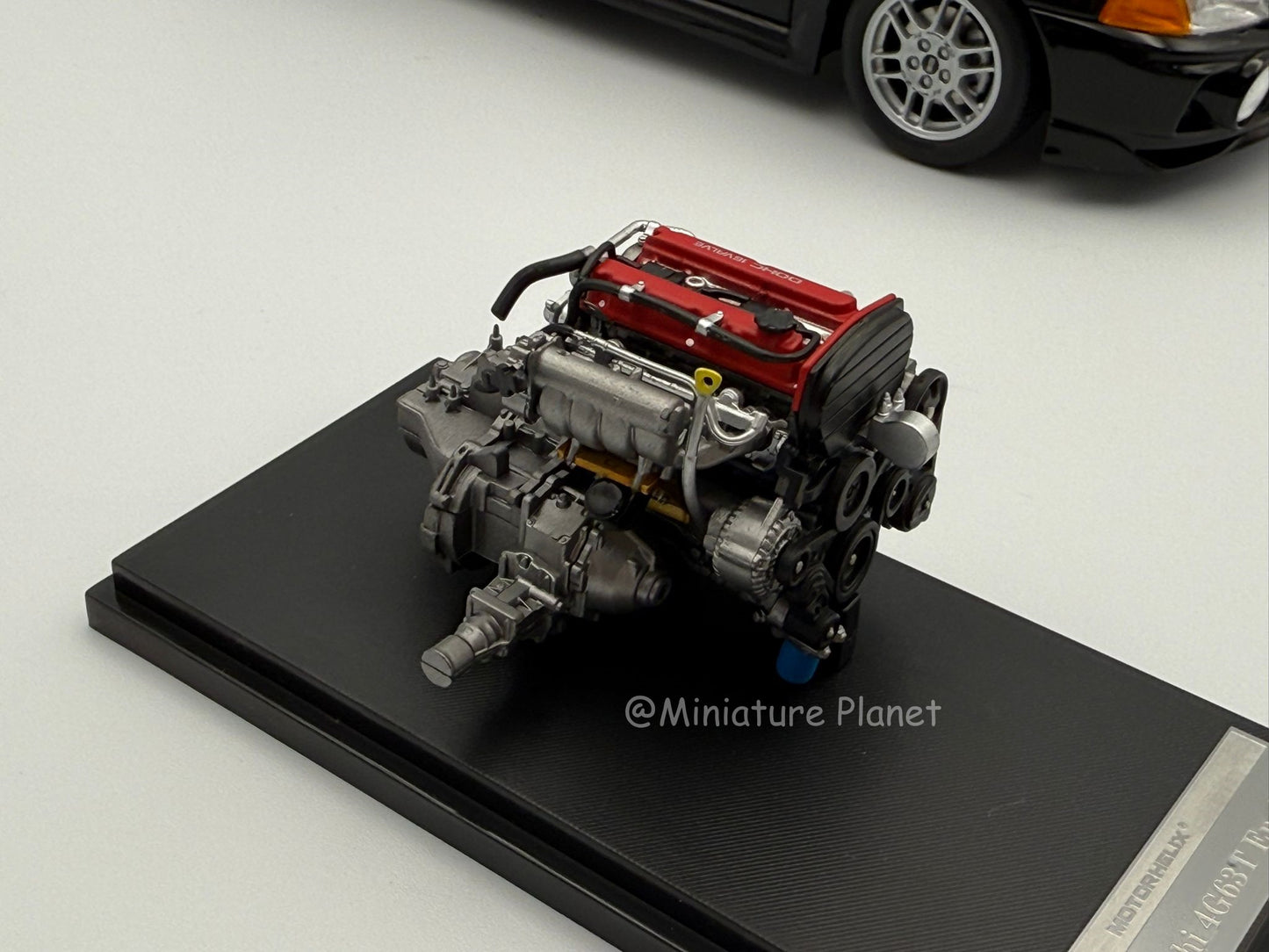 Motorhelix 1:18 Mitsubishi Evolution IV (Black Pearl)
